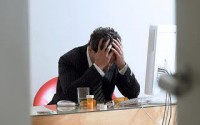 Businessman contemplating suicide by computer