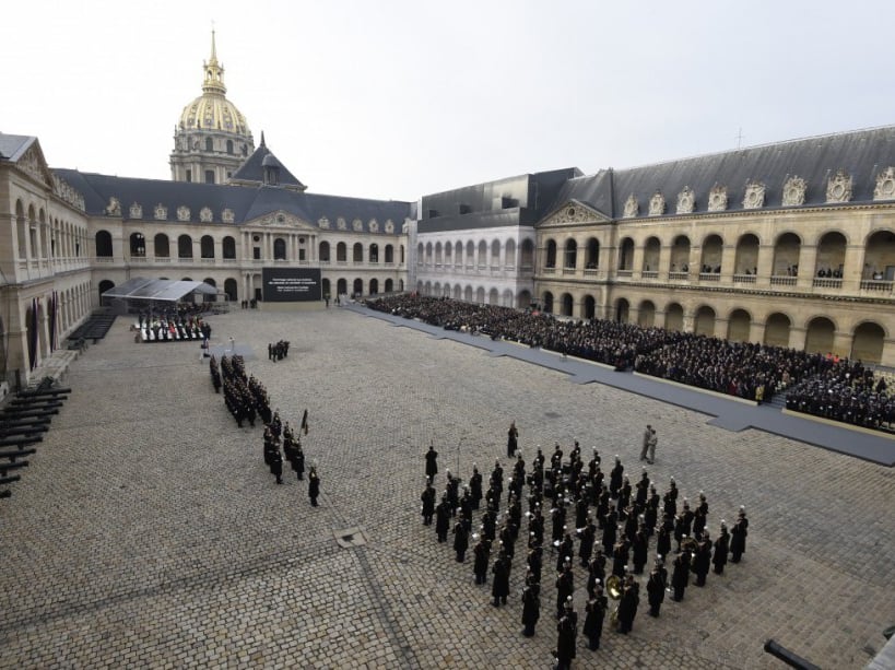 People attend the "national and republican" tribute, a solemn ceremony in honour of the 130 people killed in the November 13 Paris attacks, on November 27, 2015 at the "Hotel des Invalides". Families of those killed in France's worst-ever terror attack, claimed by the Islamic State (IS) group, will join some of the wounded at ceremonies at the Invalides. AFP PHOTO / MIGUEL MEDINA / AFP / MIGUEL MEDINA