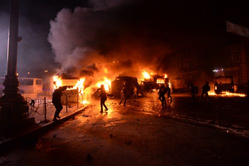 Radically oriented protesters throwing Molotov cocktails in direction of Interior troops positions. Dynamivska str. Euromaidan Protests. Events of Jan 19, 2014.